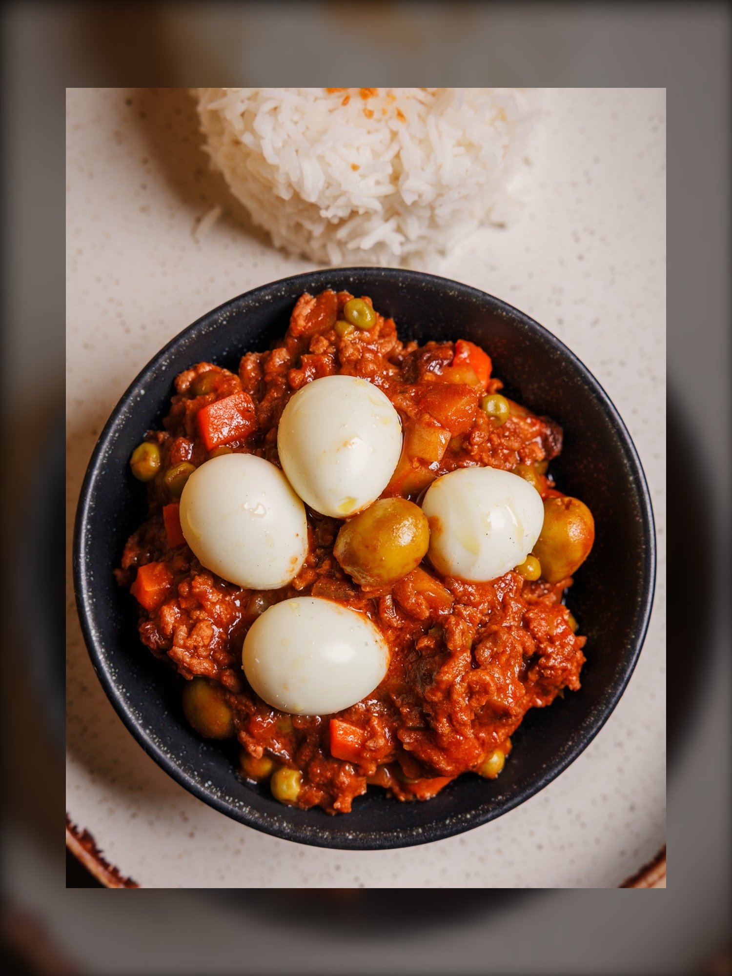 Filipino menudo with quail eggs, peas and carrots served with rice at Mina's Table