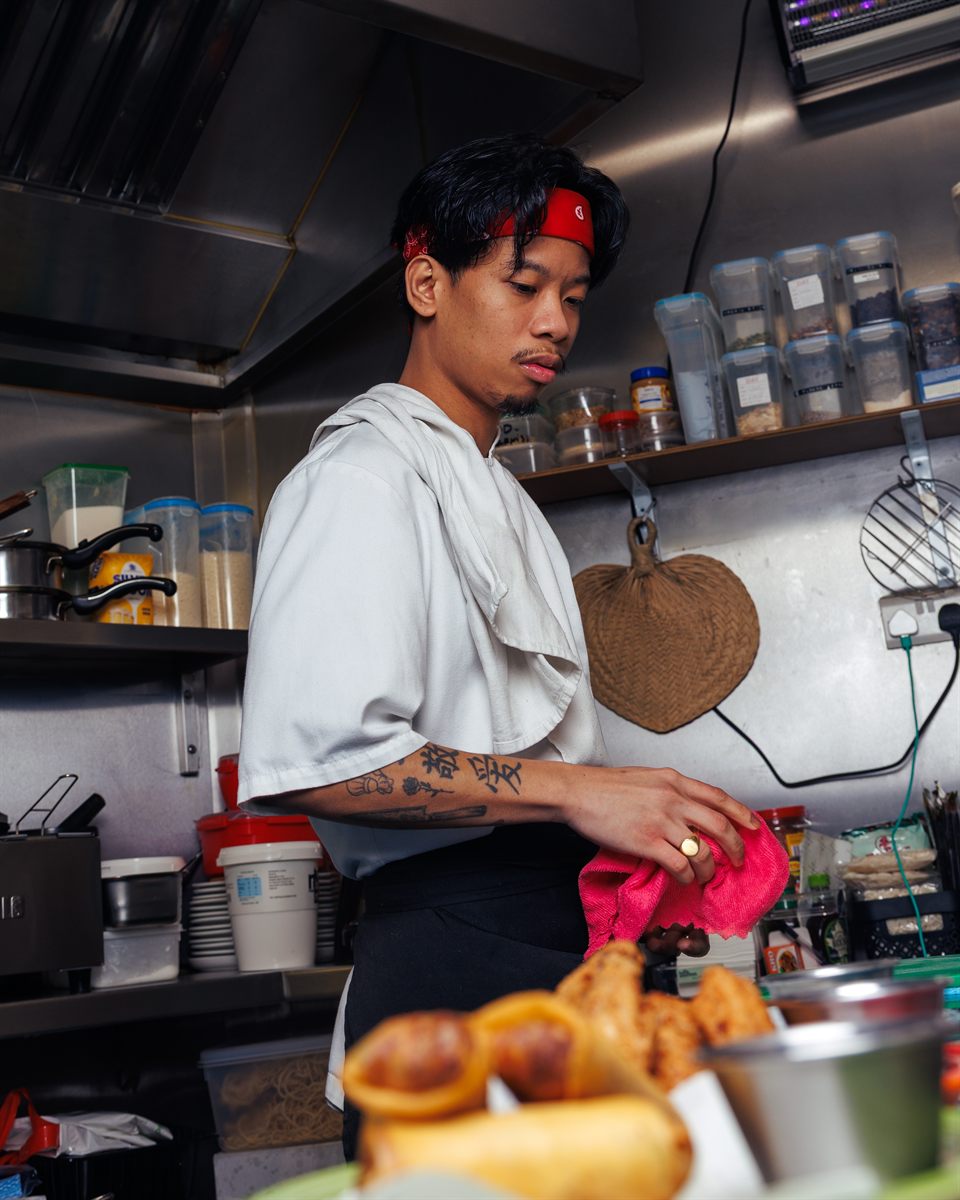 A chef working the line in the Mina's Table kitchen
